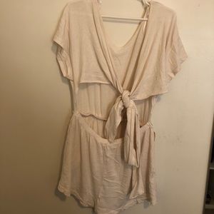 NEVER WORN Open back romper from Free People